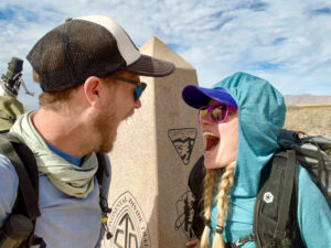 Two Backpackers at the southern monument for the Continental Divide Trail