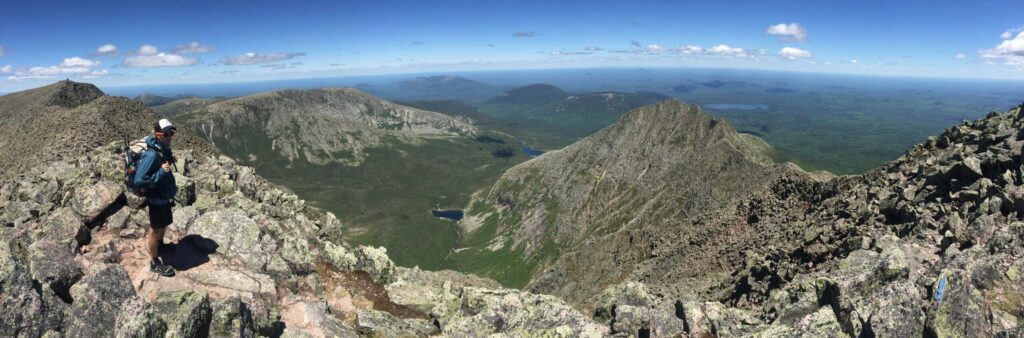 Backpacker on the Knife's Edge of Mt. Katahdin, Maine.