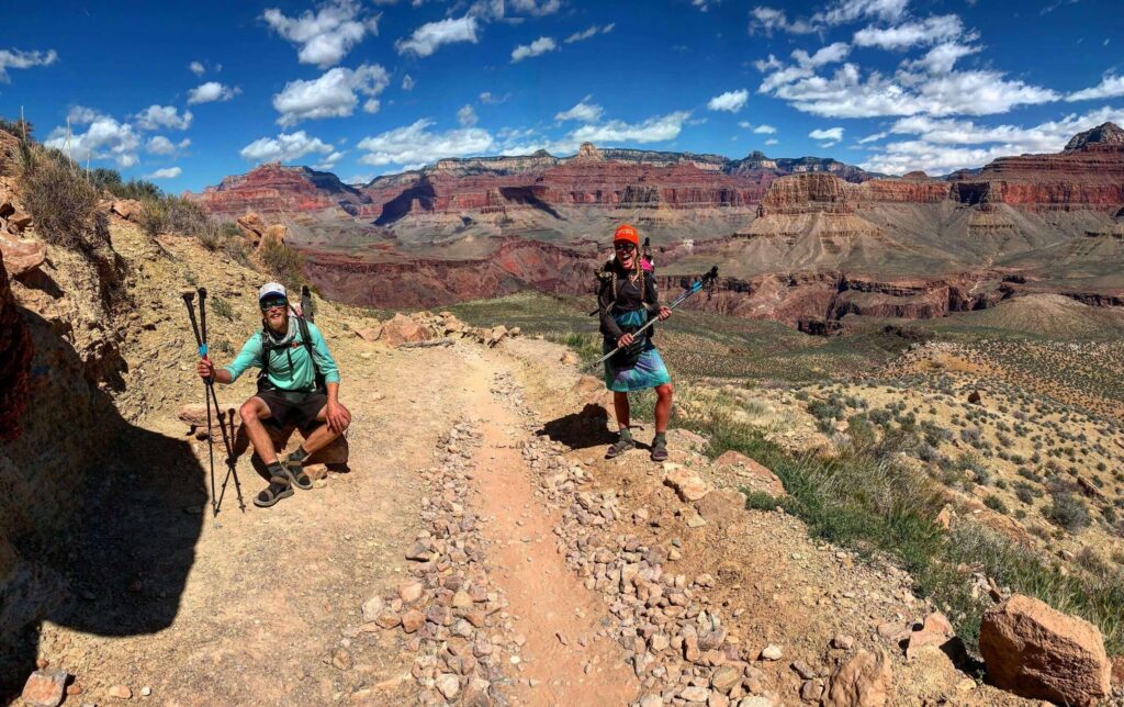 Two backpackers going into the Grand Canyon.