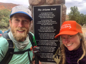 Two backpackers at the Utah border finishing their Arizona Trail thru-hike.