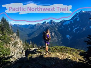 Thru-hiker in Glacier National Park at an overlook on the Pacific Northwest Trail.