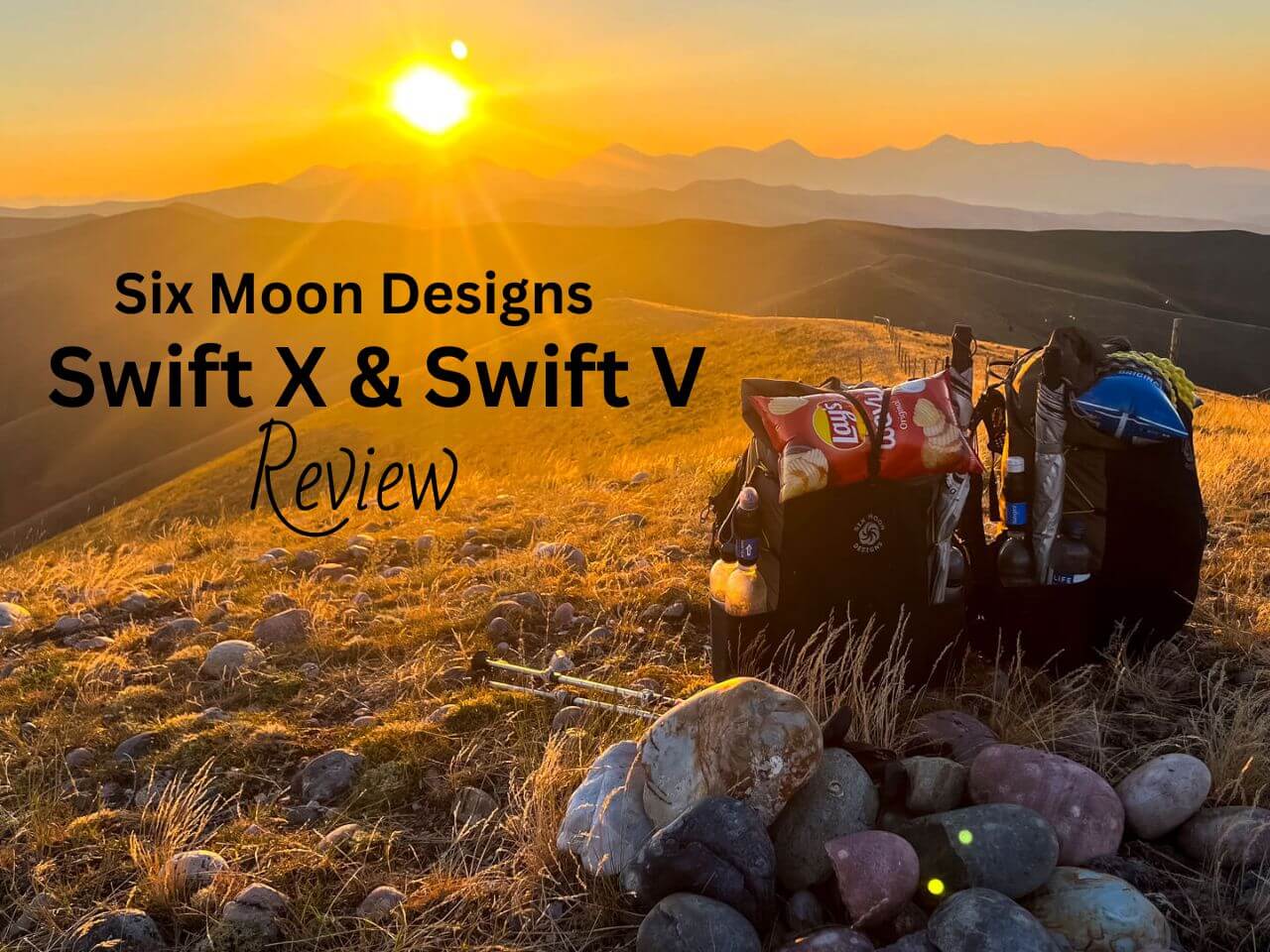 Two Six Moon Designs Swift X/V backpacks sitting on a rock on a mountain in the sunset.