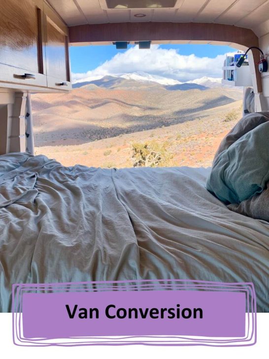 View out of the back of a van over the bed.