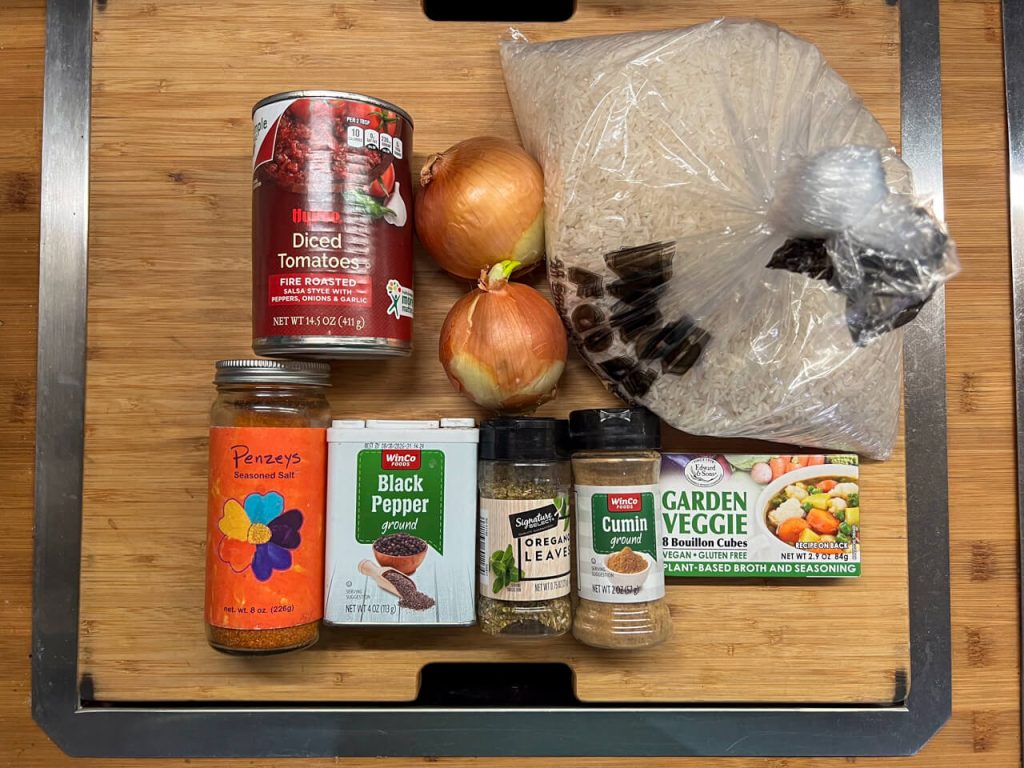 The ingredients needed to dehydrate Spanish Rice laid flat.