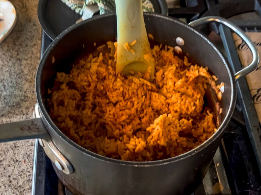Cooked Spanish Rice in a pot cooling.