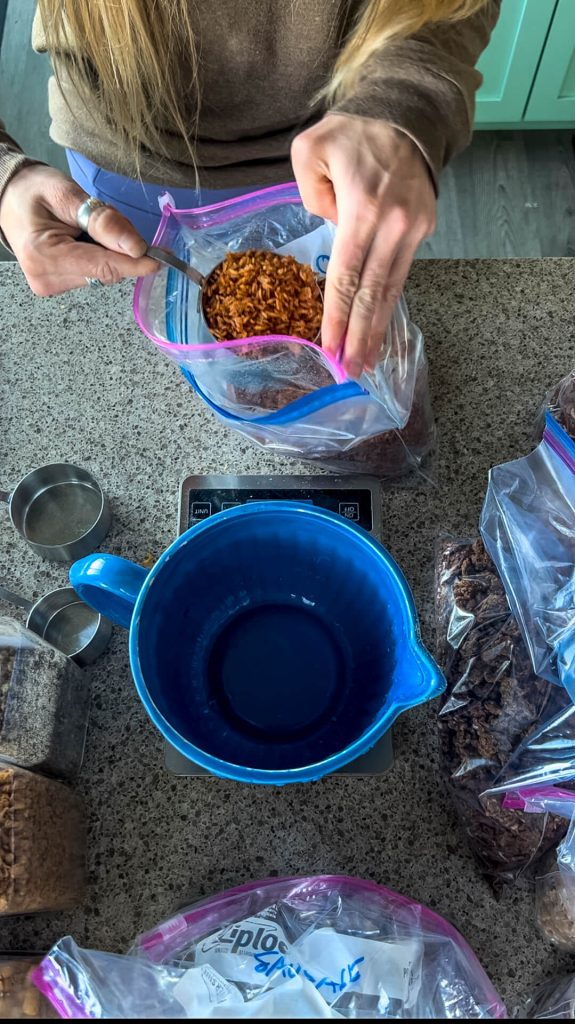 An empty bowl on a scale with a woman about to add Kung Pao flavored rice to it.