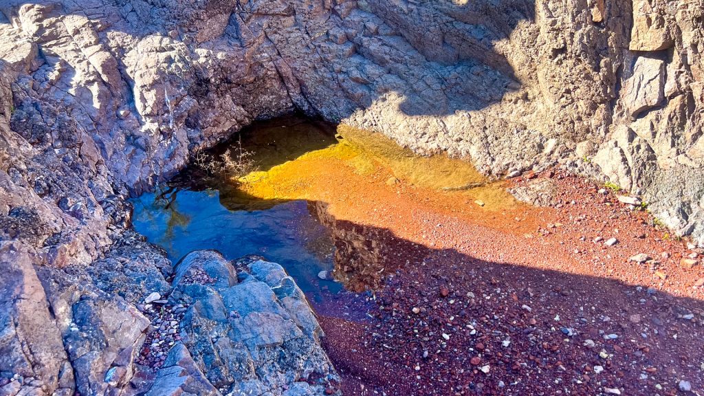 A small puddle of water at the base of a pour-off is called a Tinaja.
