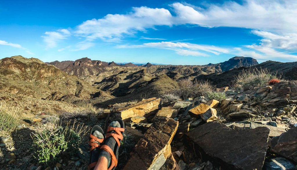 Taking a break at a view point with a woman's sandaled feet in the photo.