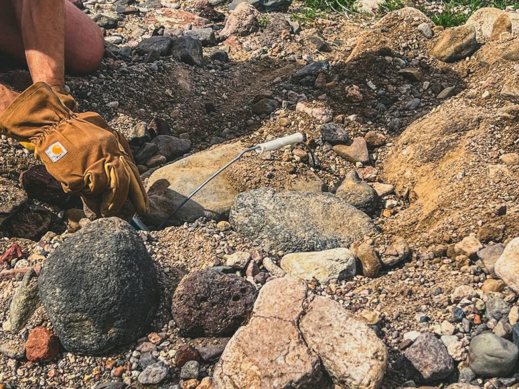 Reburying the cache to pick up later with the van.