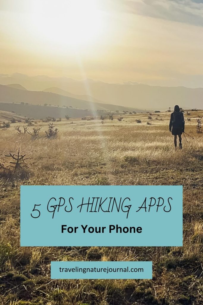 A hiker walking into the sunset using GPS phone apps.