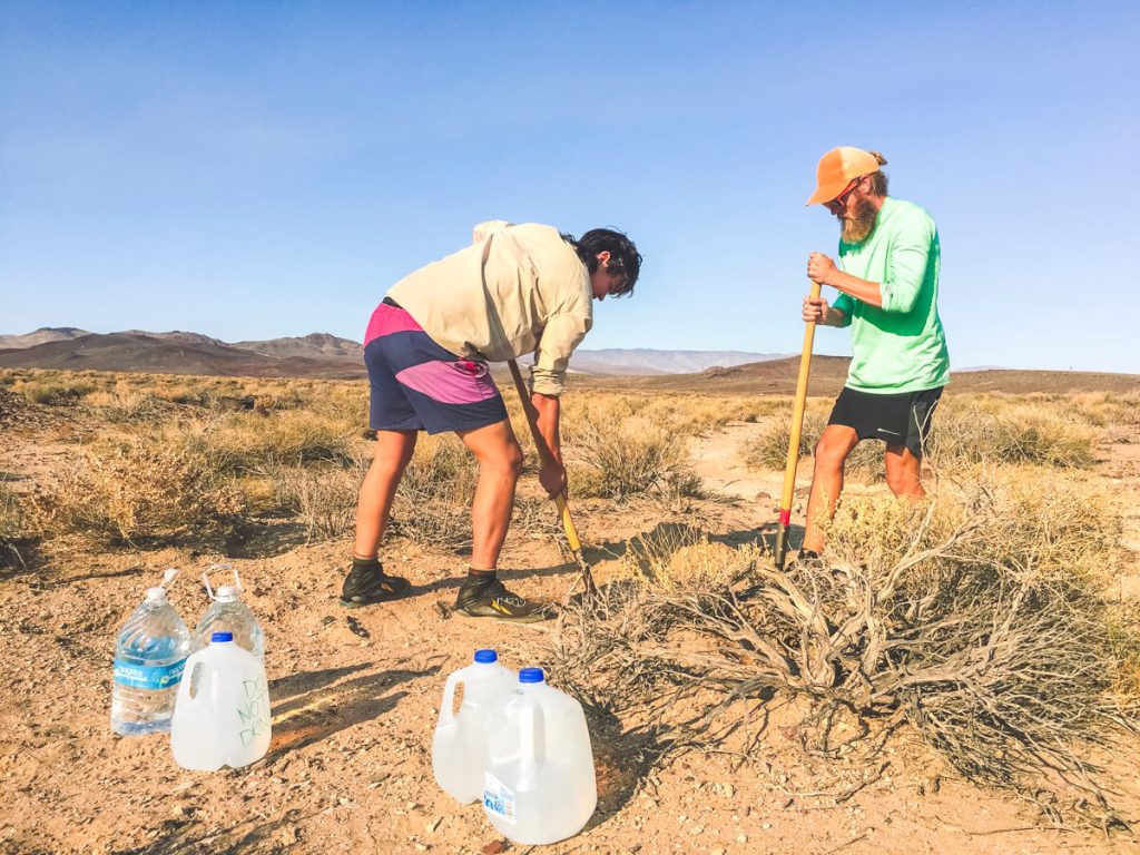 Caching water in the desert to pick up and pack out later.