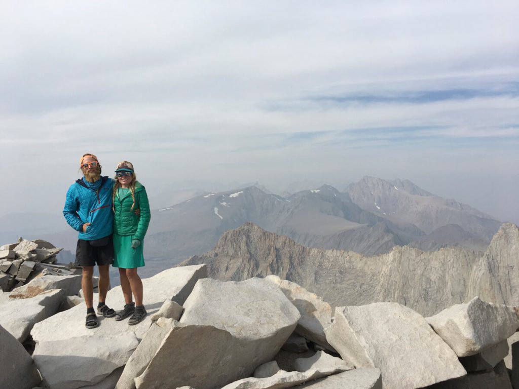 Thru-hiking couple on top of Mt. Whitney: the end of the Lowest to Highest Route