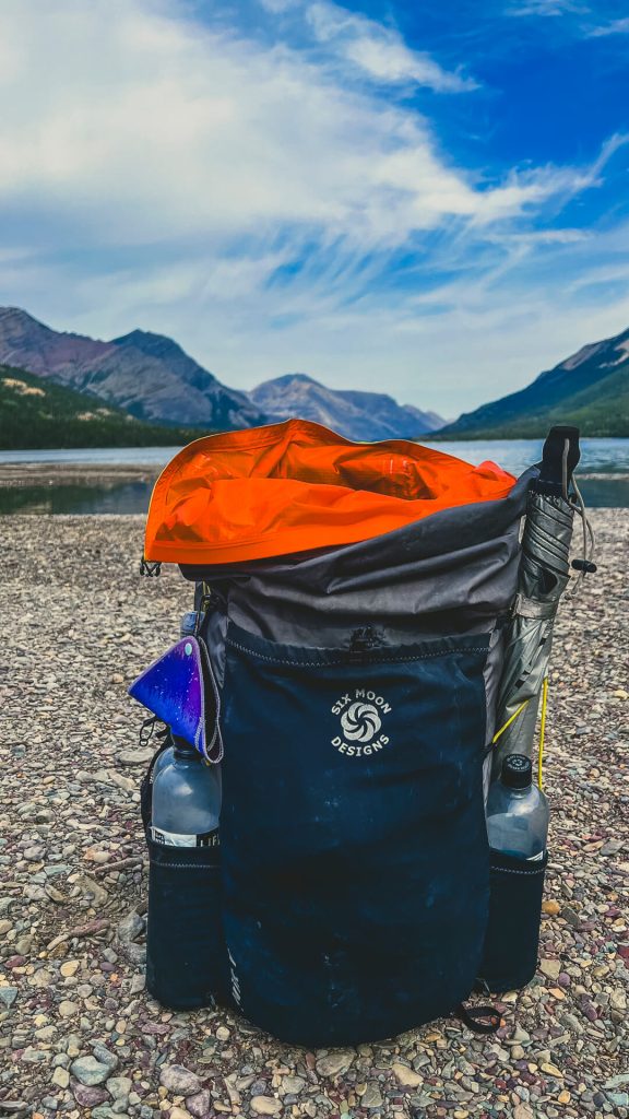 Pack liner sticking out of the top of the backpack.