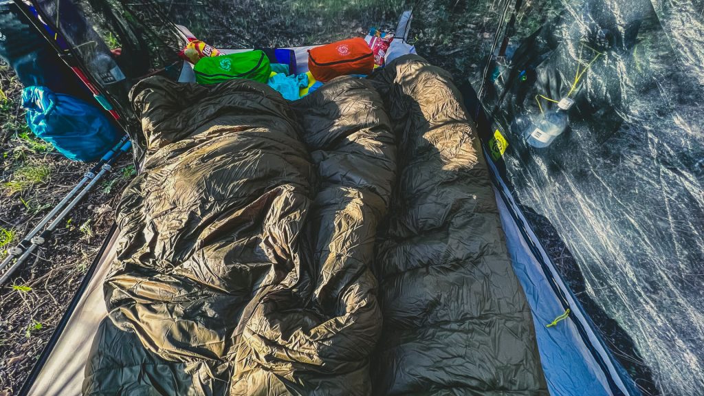The inside of the SMD haven tent with two sleeping quilts omni taped together.