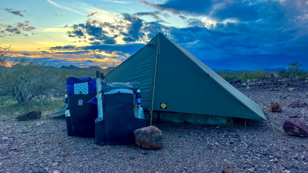 SMD Haven Tent in the desert with two backpacks: a Swift X and a Swift V.