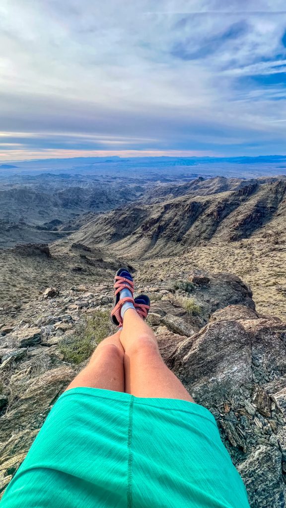 Thru-hiking woman wearing Teva Tirra Sandals.