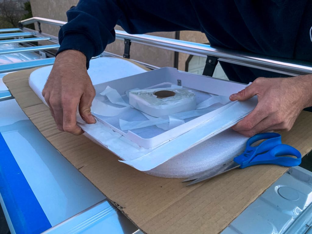 Adding butyl tape to the MaxxAir Fan mounting flange.