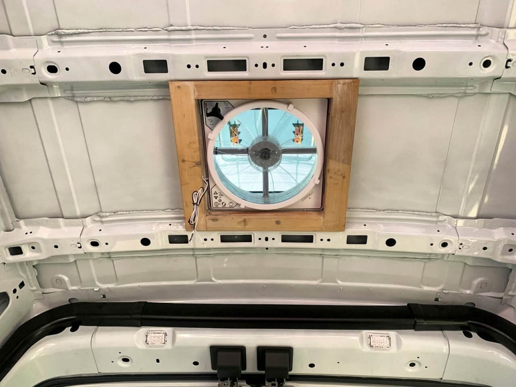 The inside of the MaxxAir Fan Deluxe with the interior wood frame.