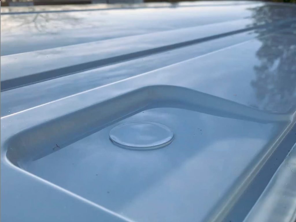 Ford Transit vans have these circular stickers waterproofing 8 holes meant for adding a roof rack.