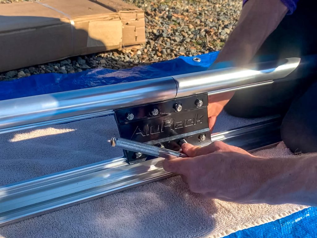 Bolting together the Prime Design Alurack side rails on the ground.