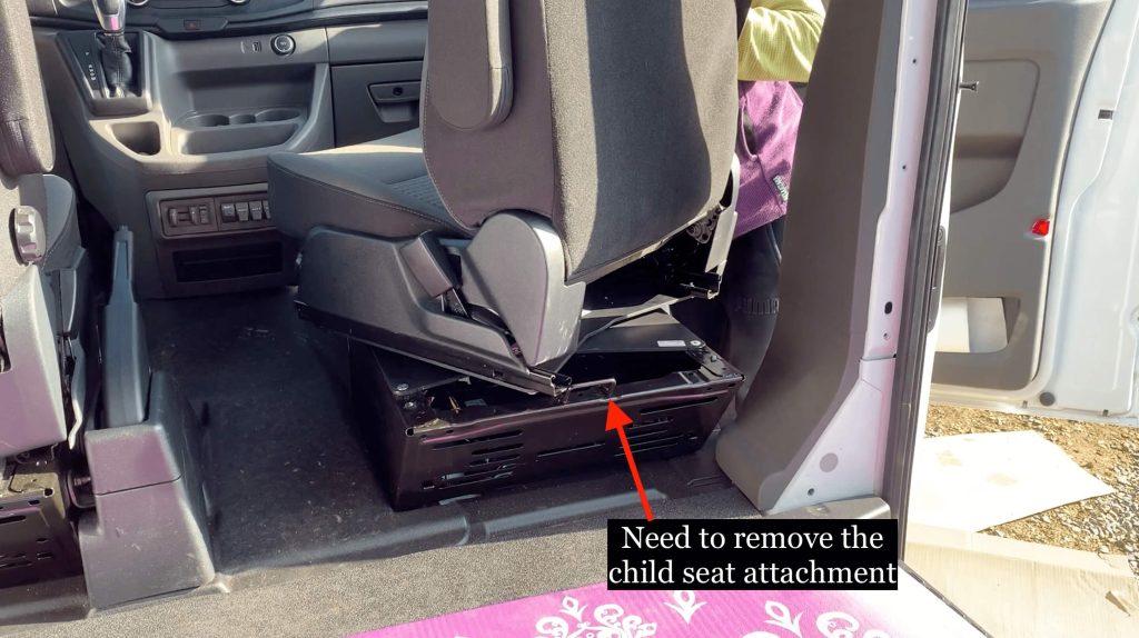 A graphic image showing the part of the seat base that needs to be removed to fully swivel the passenger seat.