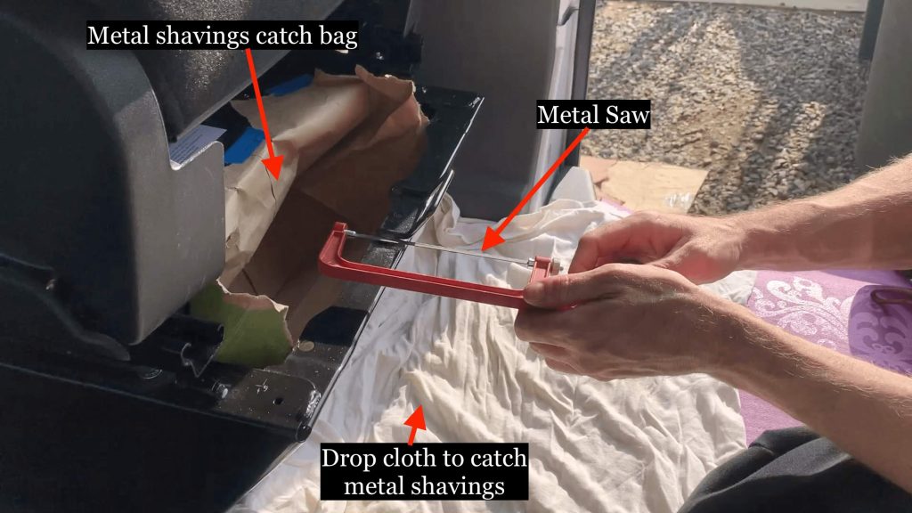 Sawing off the problem bit of metal with a graphic image with text showing where.