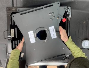 Aligning the Scopema Swivel Swivel Seat bolt holes with the seat base.
