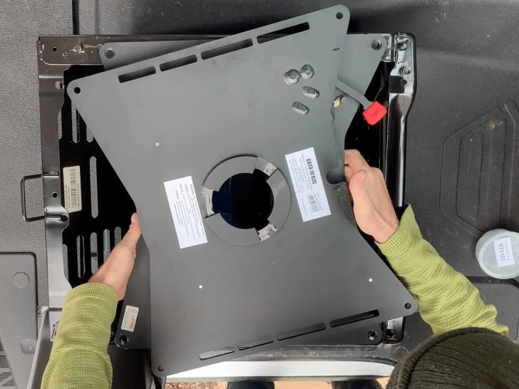 Aligning the Scopema Swivel Swivel Seat bolt holes with the seat base.