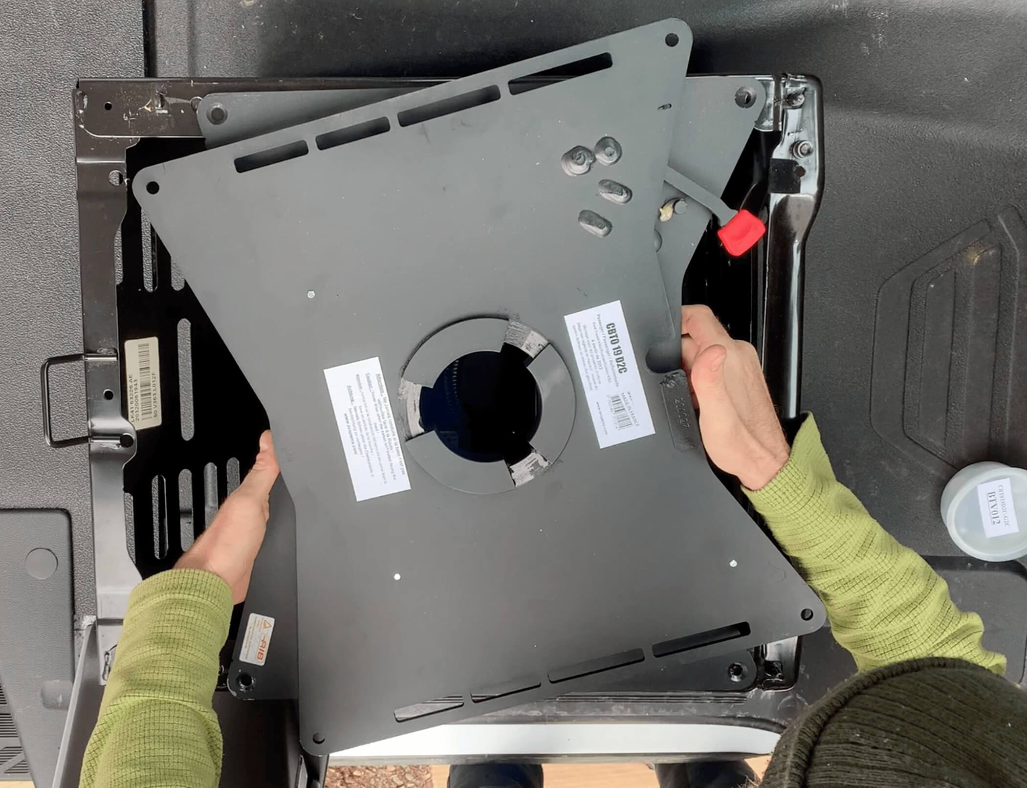 Aligning the Scopema Swivel Swivel Seat bolt holes with the seat base.