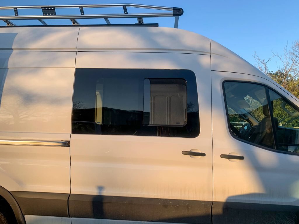 A van sliding window on a Ford Transit.