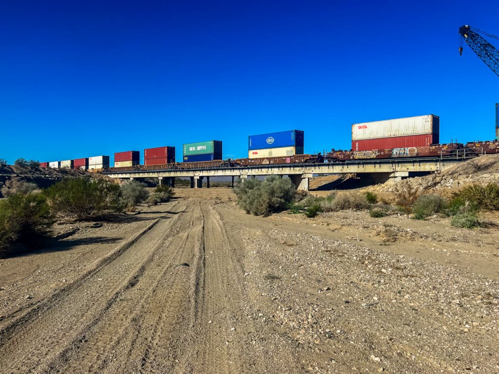 A double decker train crossing the Mojave Desert in California