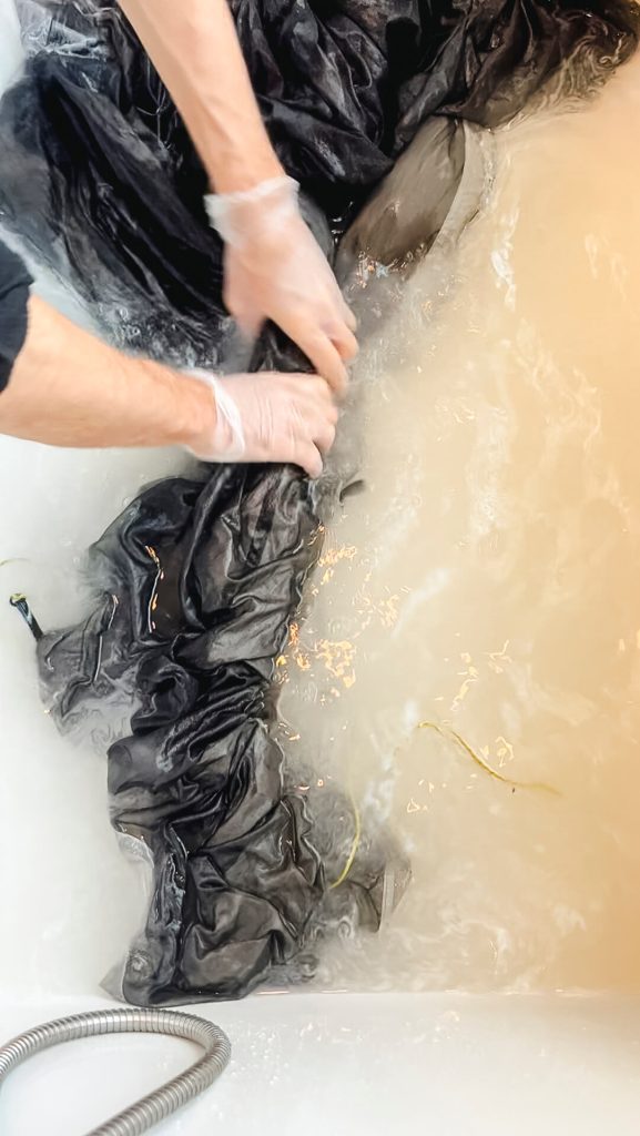 You need to agitate and squeeze in the tech wash as you clean a tent.