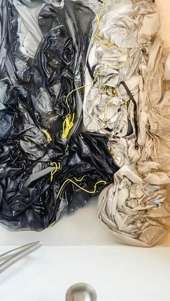 Soaking the tent in Nikwax TX Direct for 5-10 minutes.