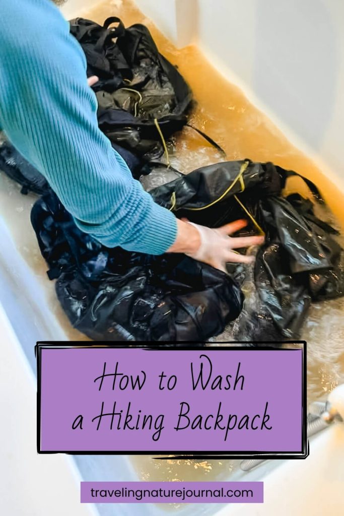Washing a hiking backpack in a tub after a thru-hike or summer of backpacking.