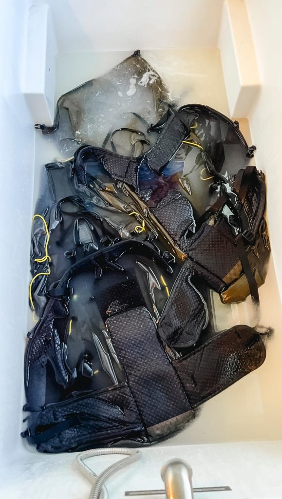 Letting backpacks sit in Nikwax TX Direct before rinsing.