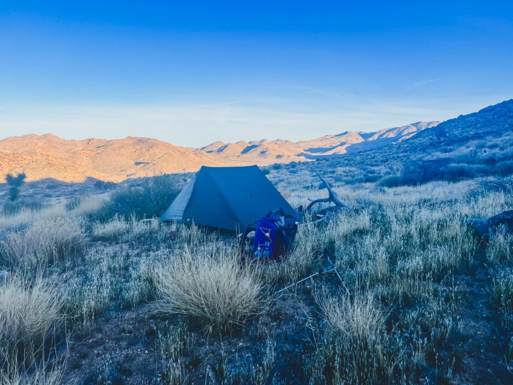 Fading light in a desert valley campsite.