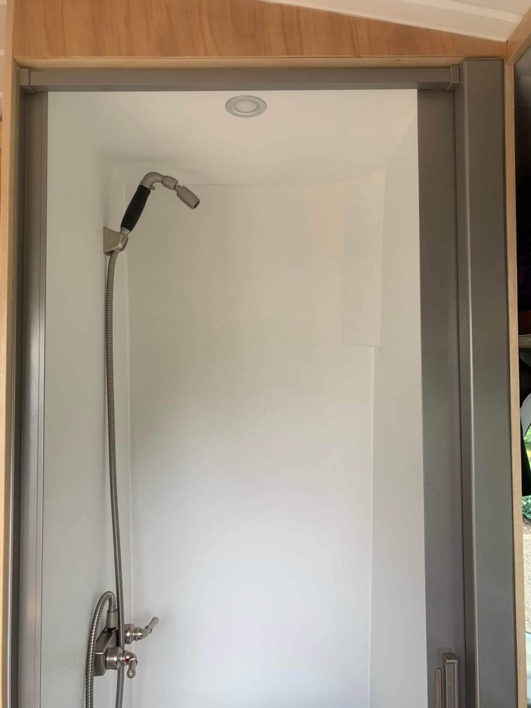 Completed indoor van shower with low flow showerhead.