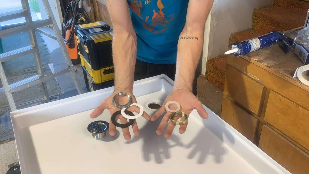 Shower pan base and drain accessories.