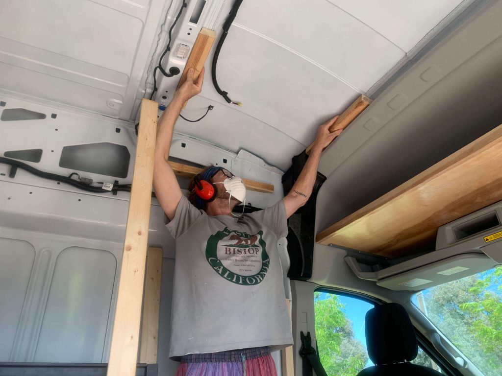 Adding the shaped 2x3s to the pillars to frame the indoor van shower.