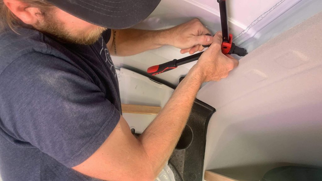 Using a riv nut tool to add nutserts for bolting purposes.