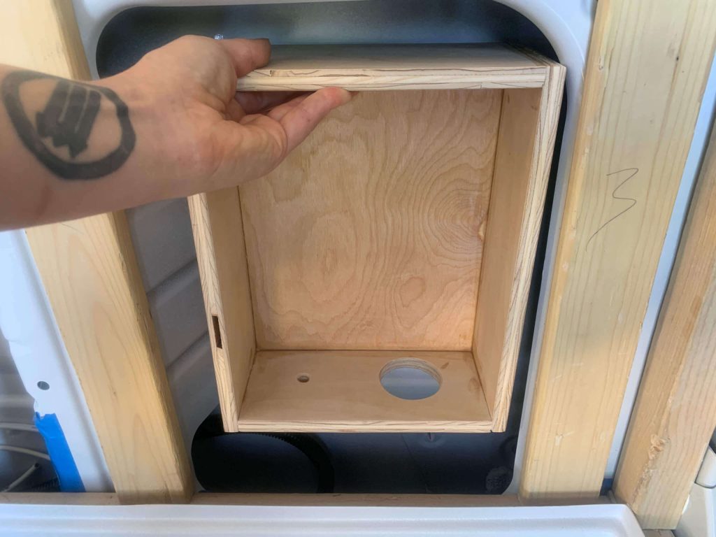 Hidden shower cubby to hold composting toilet vent hose and electrical.