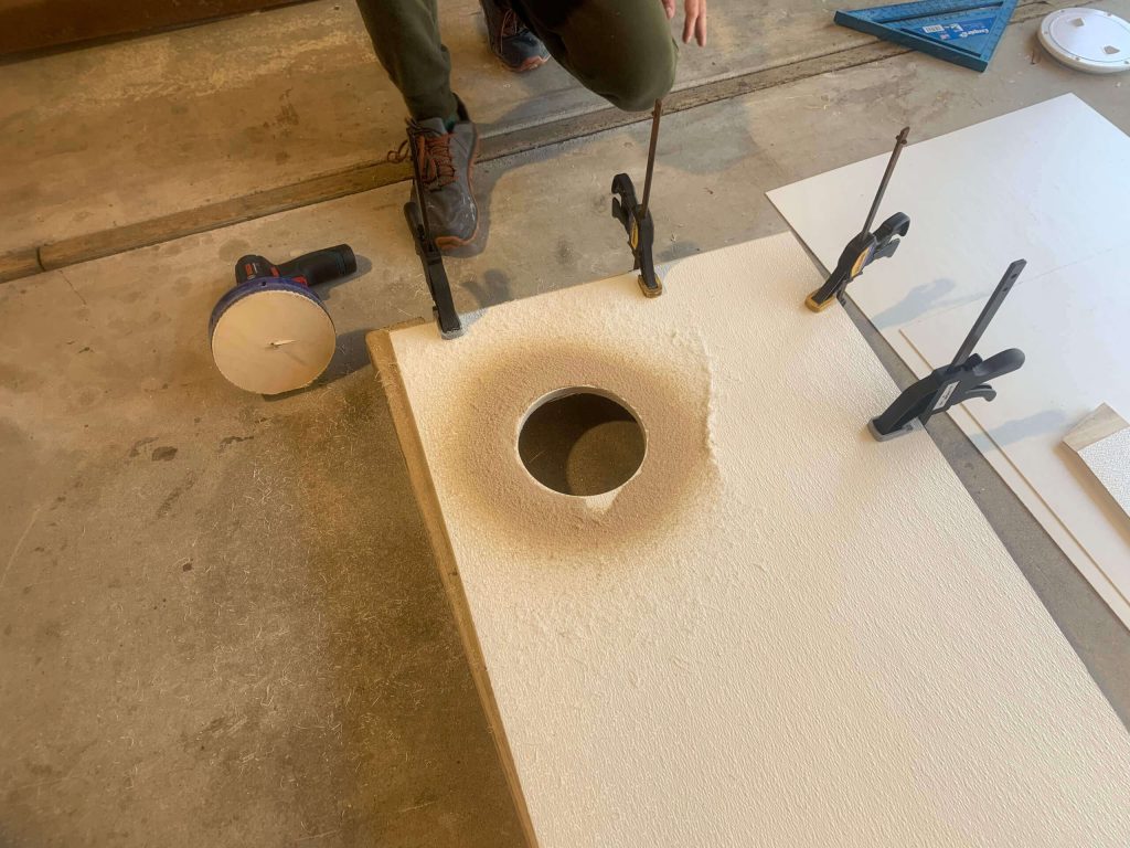 Cutting a hole in the back shower wall for the waterproof hatch.