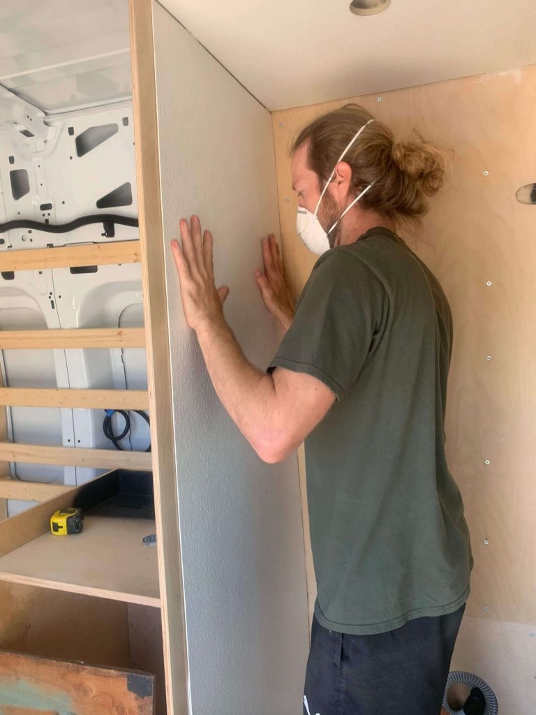 Pressing FRP Board to the walls.