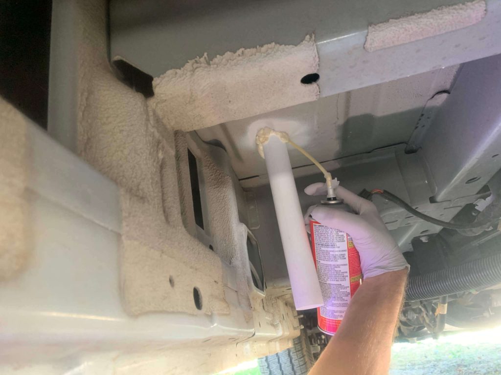 Using Big Gap Filler around drain tailpipe.