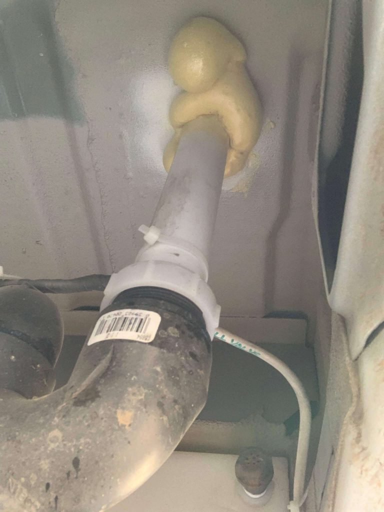 Drain tailpipe coming down to the p-trap and the gap filled with Big Gap Filler.