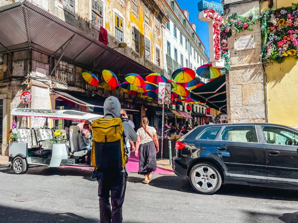Walking through the streets of Lisbon through the umbrella street.
