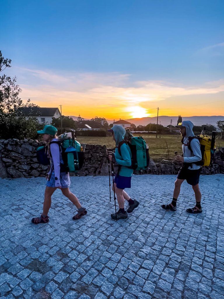 Three people walking on the Portuguese Camino.