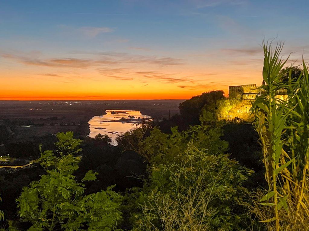 Sunrise from Santar&eacute;m, Portugal over a river.