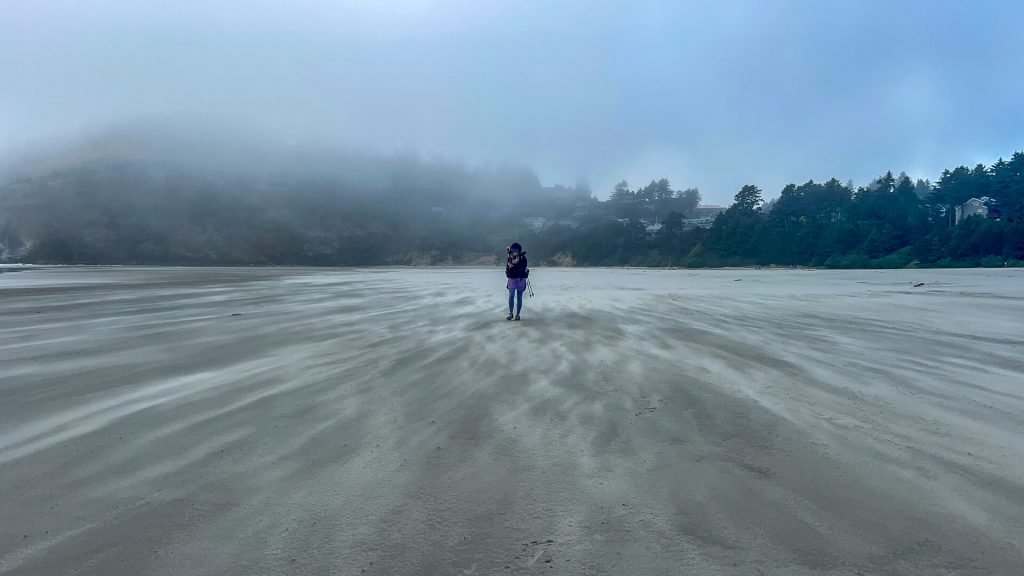 Veggie hiking the Oregon Coast Trail southbound with the wind (and sand) at her back.