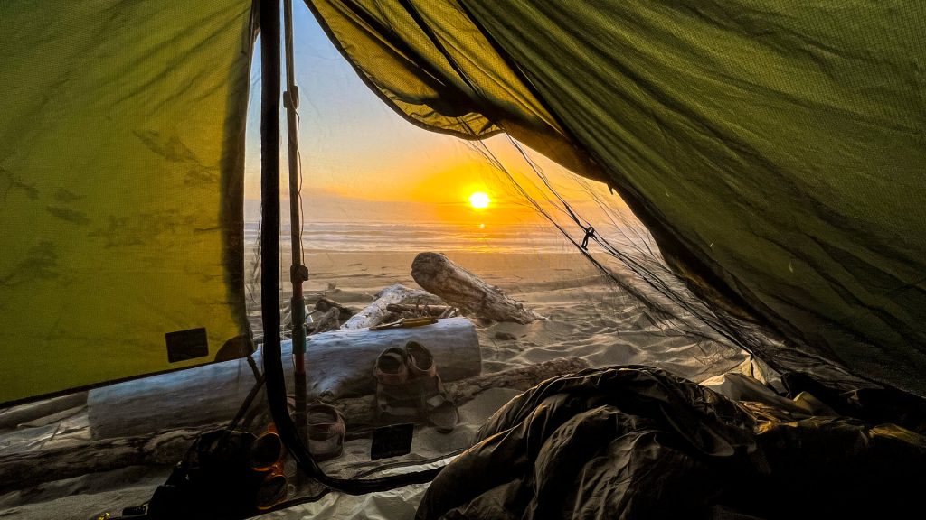 Dispersed Beach Oregon Coast Trail Camping with a sunset.